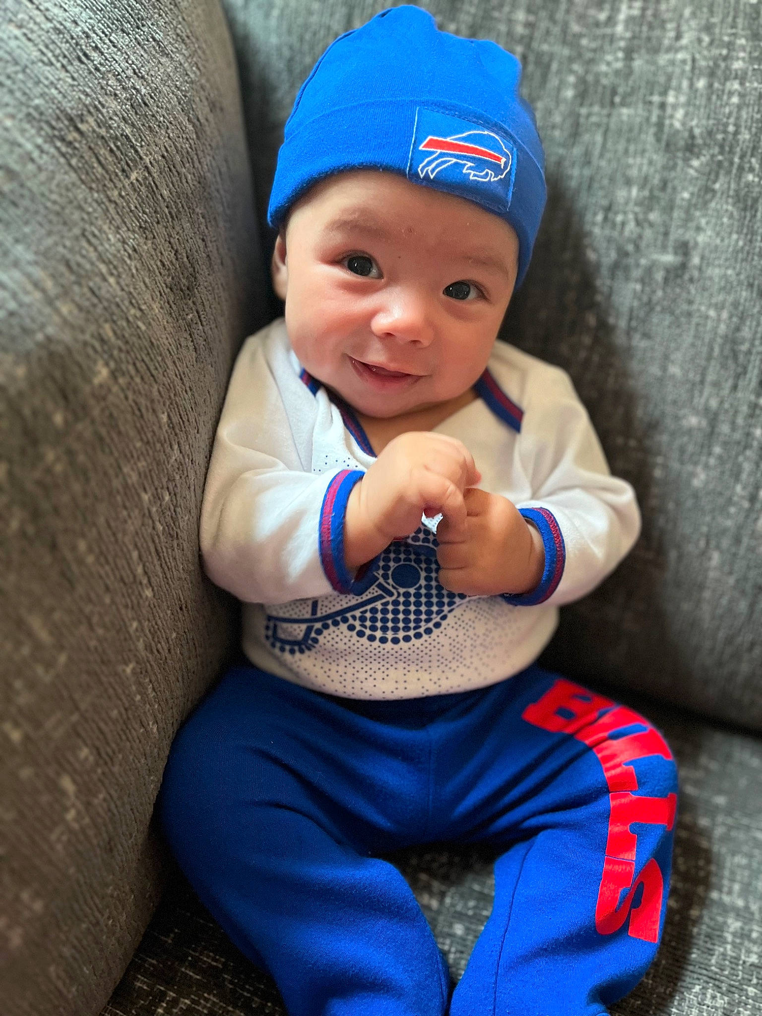 Emmett joined the competition — help win amazing prizes! azure, baby, baby_toddler_clothing, baseball_cap, blue, cap, child, cool, electric_blue, fashion_accessory, flash_photography, grass, happy, headgear, headwear, leisure, person, personal_protective_equipment, sitting, sun_hat