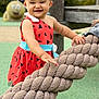 child, toddler, smiling, outdoor, playground, rope, dress, headband, barefoot, happy, toy, wood, green_ground, daylight, person, nature, fun, cute, recreation, background
