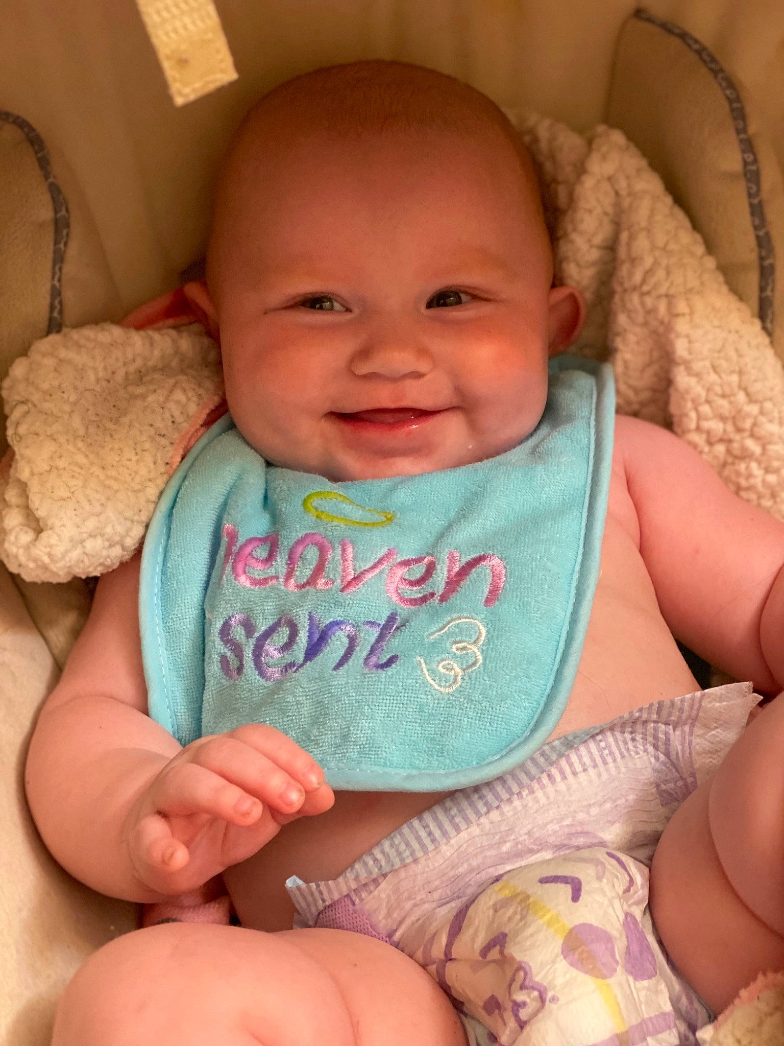 Carly is registered to the contest to win money with this photo: baby_toddler_clothing, cheek, chin, comfort, eye, eyebrow, face, facial_expression, hair, hairstyle, hand, head, joy, leg, lip, mouth, nose, organ, person, product