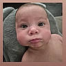 baby, infant, face, expression, chubby_cheeks, elephant_pillow, soft_texture, skin, portrait, young_child, cute, indoor, head, eyes, mouth, person, child, closeup, baby_face, lying_down