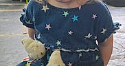 Abigail is registered to the contest to win money with this photo: child, toddler, baby_chicks, dress, stars_pattern, smiling, sitting, floor, indoor, natural_light, windows, blond_hair, cute, happy, animal, pet, baby, playful, young, portrait