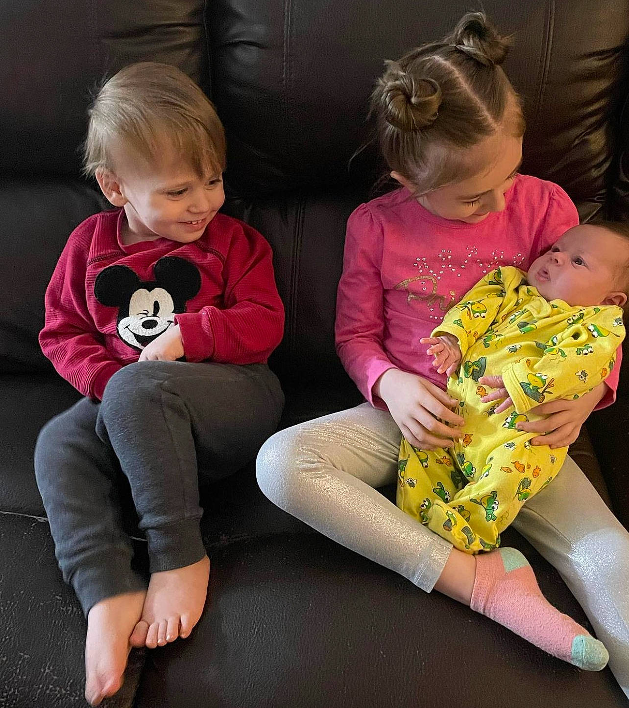 Lillian is registered to the contest to win money with this photo: baby, baby_toddler_clothing, blond, child, comfort, couch, fun, happy, human_body, human_leg, joy, knee, lap, mouth, person, pink, sitting, skin, sock, standing