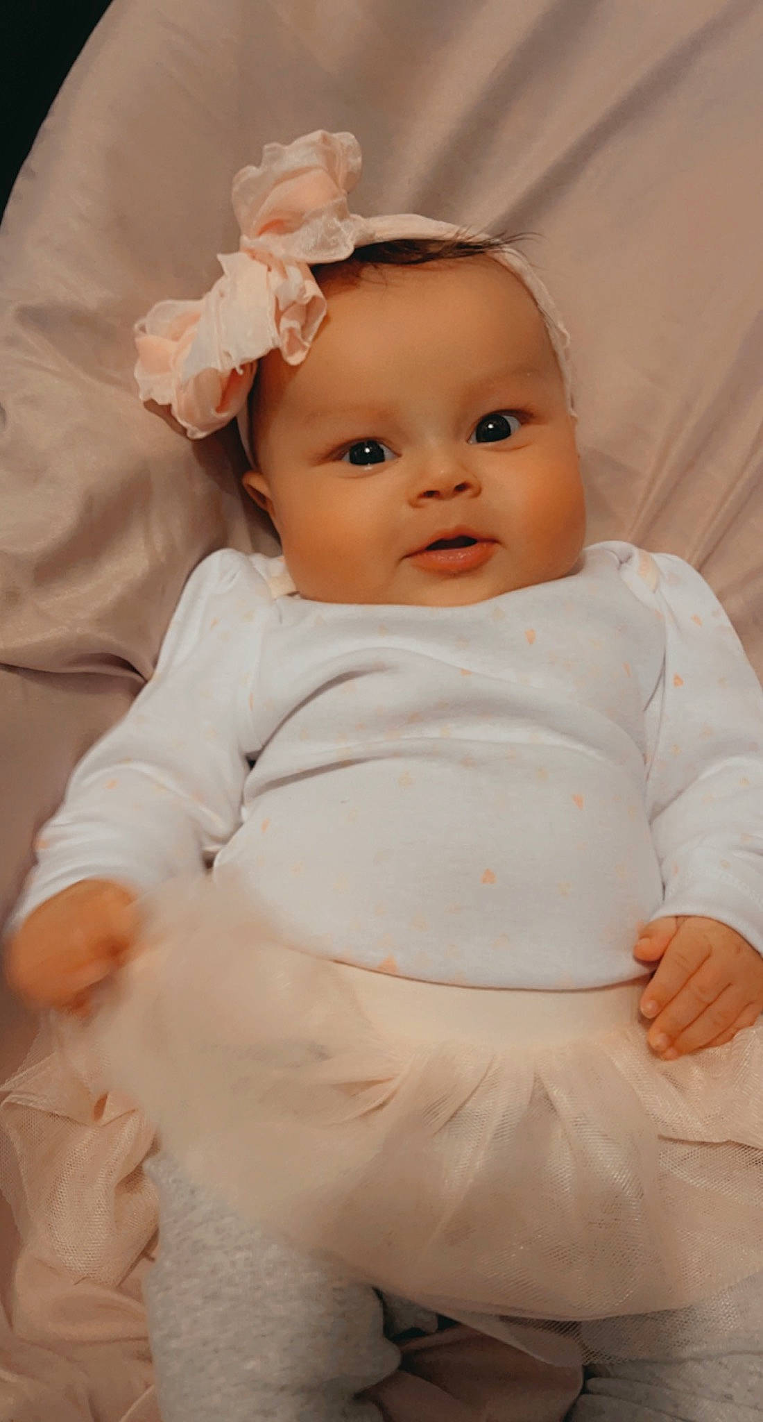 Reigna is registered to the contest to win money with this photo: baby, baby_toddler_clothing, cheek, child, chin, comfort, dress, eye, eyebrow, happy, headgear, human_body, iris, lip, nose, person, pink, skin, sleeve, toddler