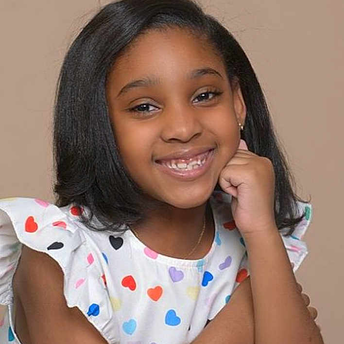 Nailah joined the competition — help win amazing prizes! blackhair, blouse, bodypart, child, clothing, dimples, face, female, girl, hair, happy, head, neck, person, photography, portrait, shoulder, smile