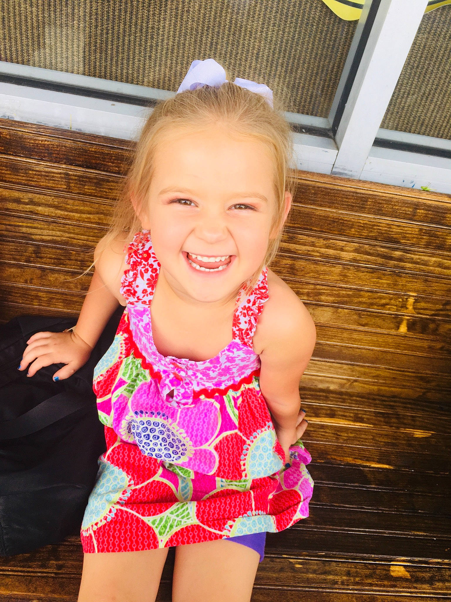 Isabella is registered to the contest to win money with this photo: baby_toddler_clothing, beauty, clothing, face, fun, hair, happy, head, joy, long_hair, magenta, neck, one_piece_swimsuit, pattern, person, pink, skin, smile, swimwear, thigh