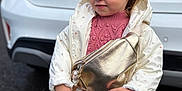 Lyha a rejoint le concours — aidez-le/la à gagner de superbes lots ! toddler, child, girl, white_jacket, pink_dress, gold_purse, pacifier, outdoor, car, ford, license_plate, parking_lot, cute, portrait, fashion, blond_hair, earrings, expression, standing, casual