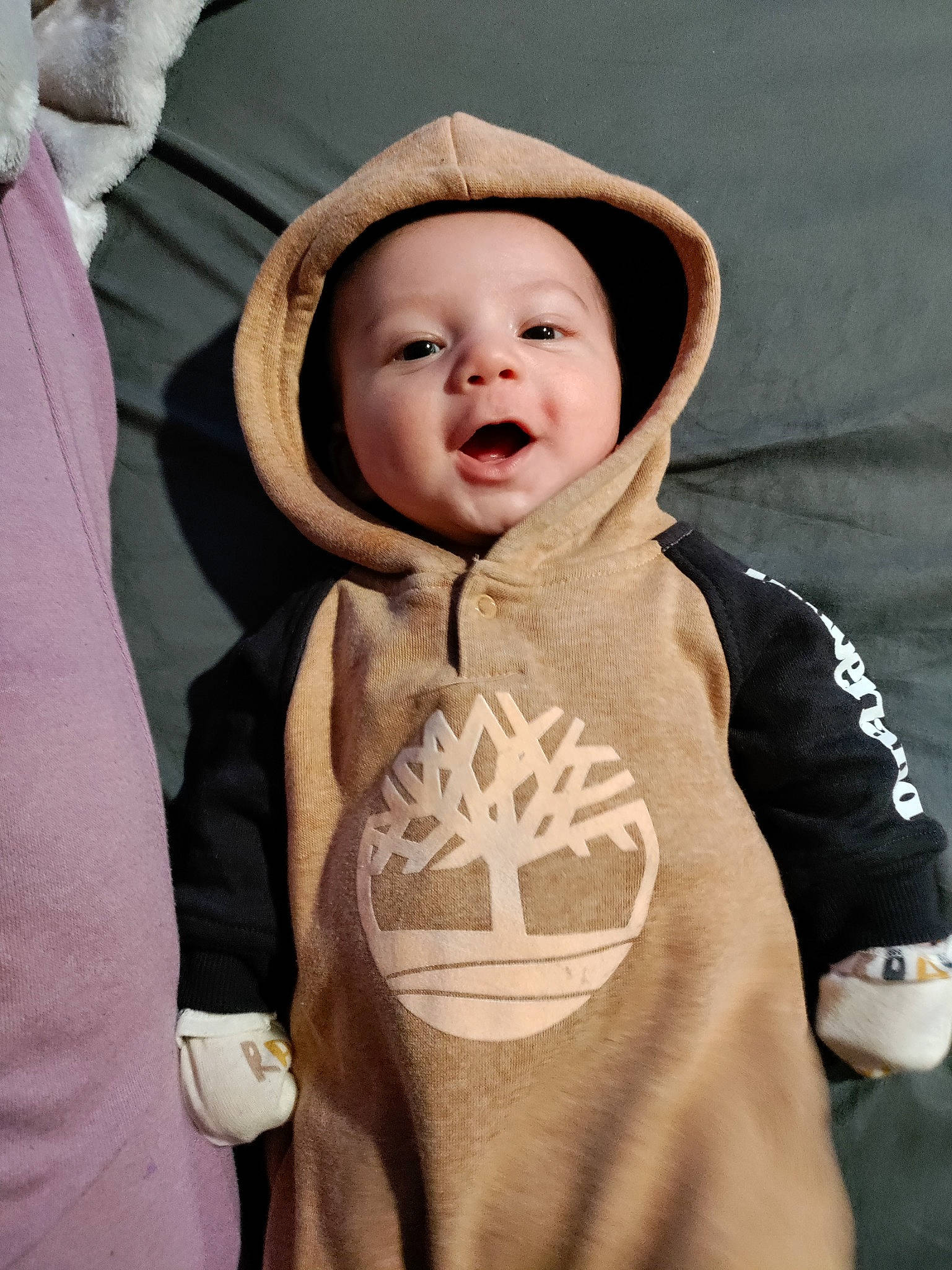 Kobe is registered to the contest to win money with this photo: baby, baby_toddler_clothing, child, comfort, cool, flash_photography, fun, gesture, happy, hat, head, headgear, headwear, human_body, lip, outerwear, person, sleeve, smile, standing