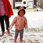 Kya joined the competition — help win amazing prizes! child, snow, winter_clothing, pink_jacket, mickey_mouse_ears, gloves, boots, snowfall, outdoor, grass, trailer, happy, playful, person, adult, red_jacket, pants, smile, cold_weather, snowy_ground