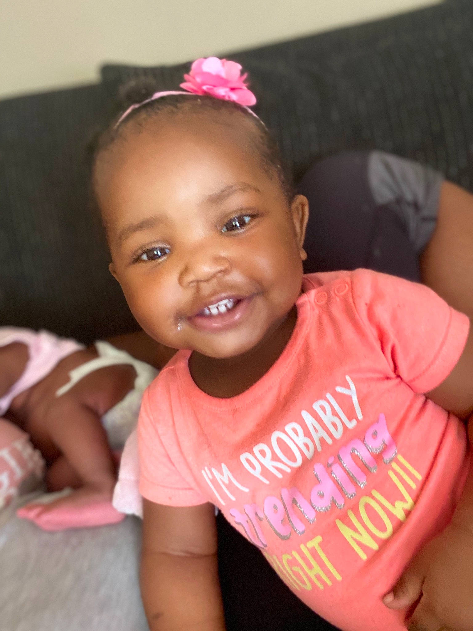 Amaani is registered to the contest to win money with this photo: baby, baby_toddler_clothing, cheek, child, face, forehead, fun, hair_accessory, happy, head, headband, joy, lip, person, pink, skin, smile, toddler