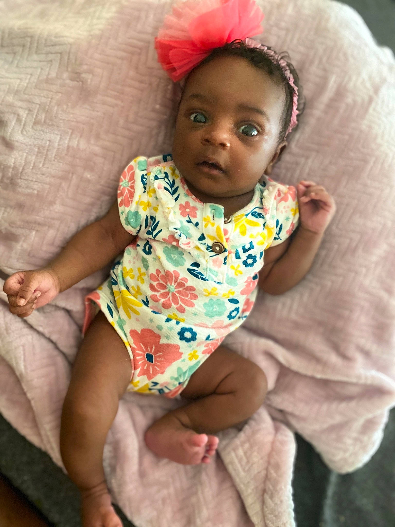 Aryiana joined the competition — help win amazing prizes! baby, baby_products, baby_toddler_clothing, cheek, child, head, headgear, linens, person, pink, sitting, skin, smile, textile, toddler