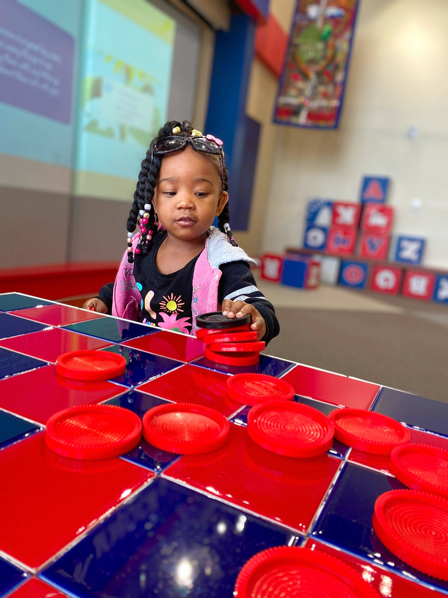 Serenity is registered to the contest to win money with this photo: child, fun, games, happy, headwear, holiday, leisure, person, play, red, smile, toddler