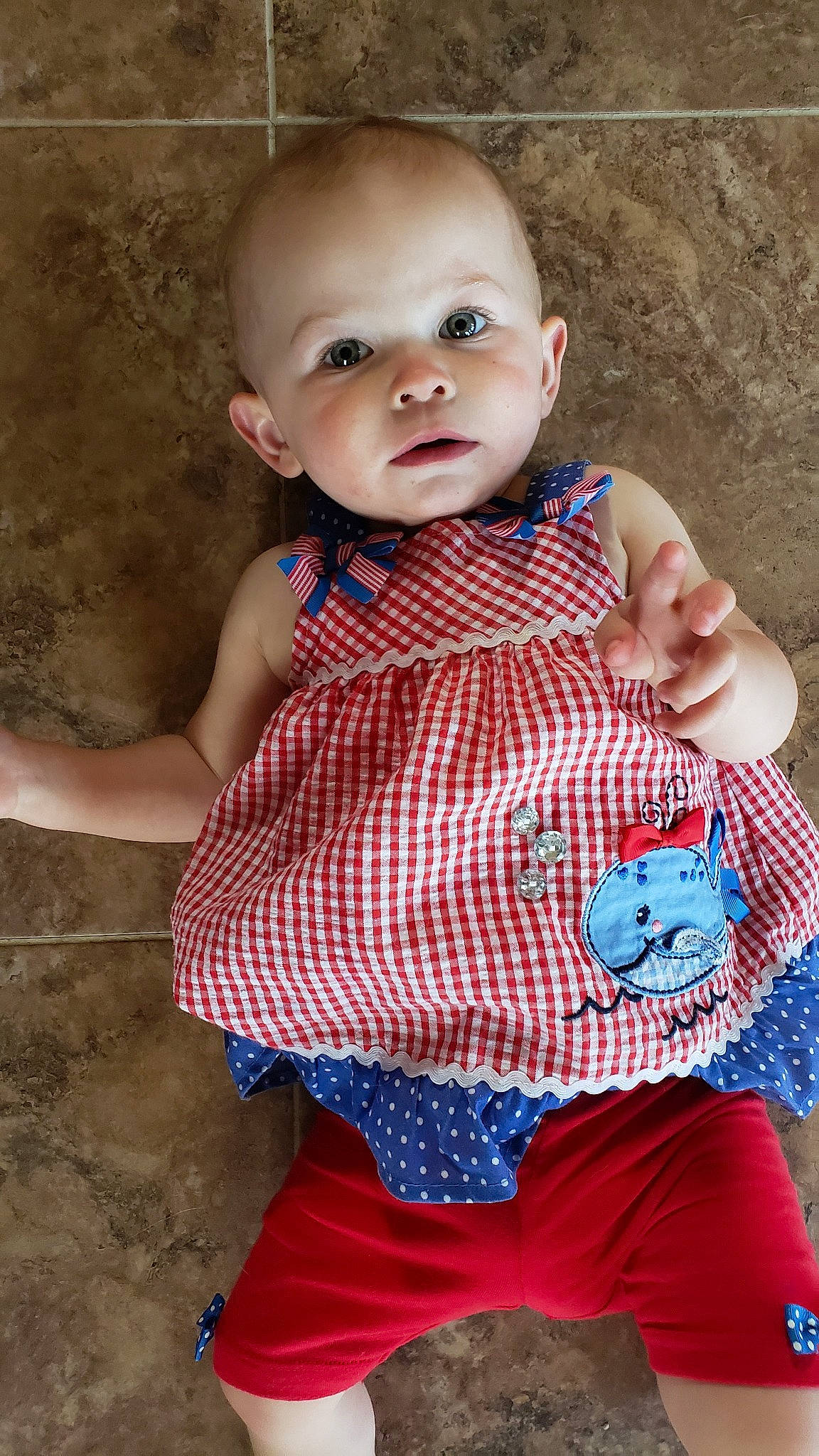 Addylyn is registered to the contest to win money with this photo: baby, baby_products, baby_toddler_clothing, blue, cheek, child, child_model, design, face, head, lip, outerwear, pattern, person, plaid, red, skin, smile, textile, toddler