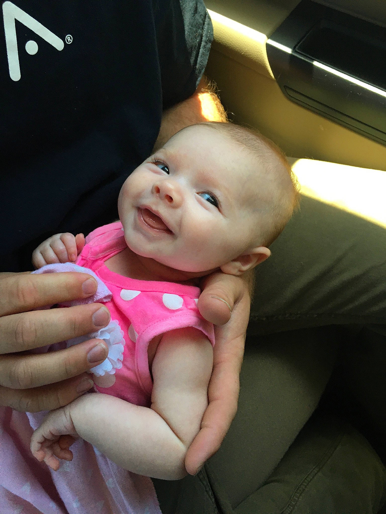 Coco is registered to the contest to win money with this photo: baby, baby_in_car_seat, beauty, car_seat, cheek, child, finger, hand, person, pink, product, skin, toddler