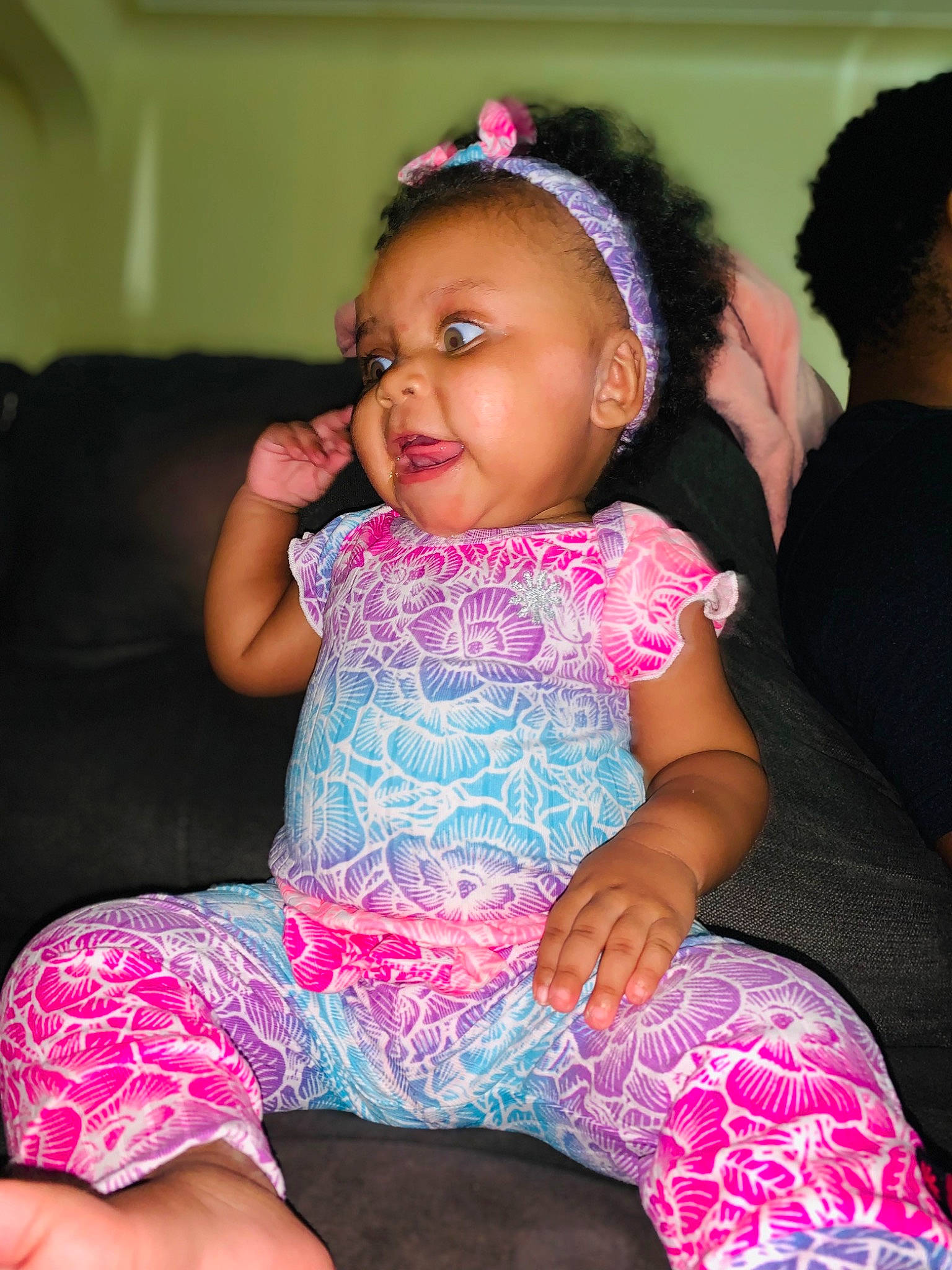 Kai is registered to the contest to win money with this photo: baby_toddler_clothing, black_hair, cheek, child, dress, face, fun, hairstyle, happy, head, iris, lap, lip, magenta, person, pink, purple, skin, sleeve, thigh