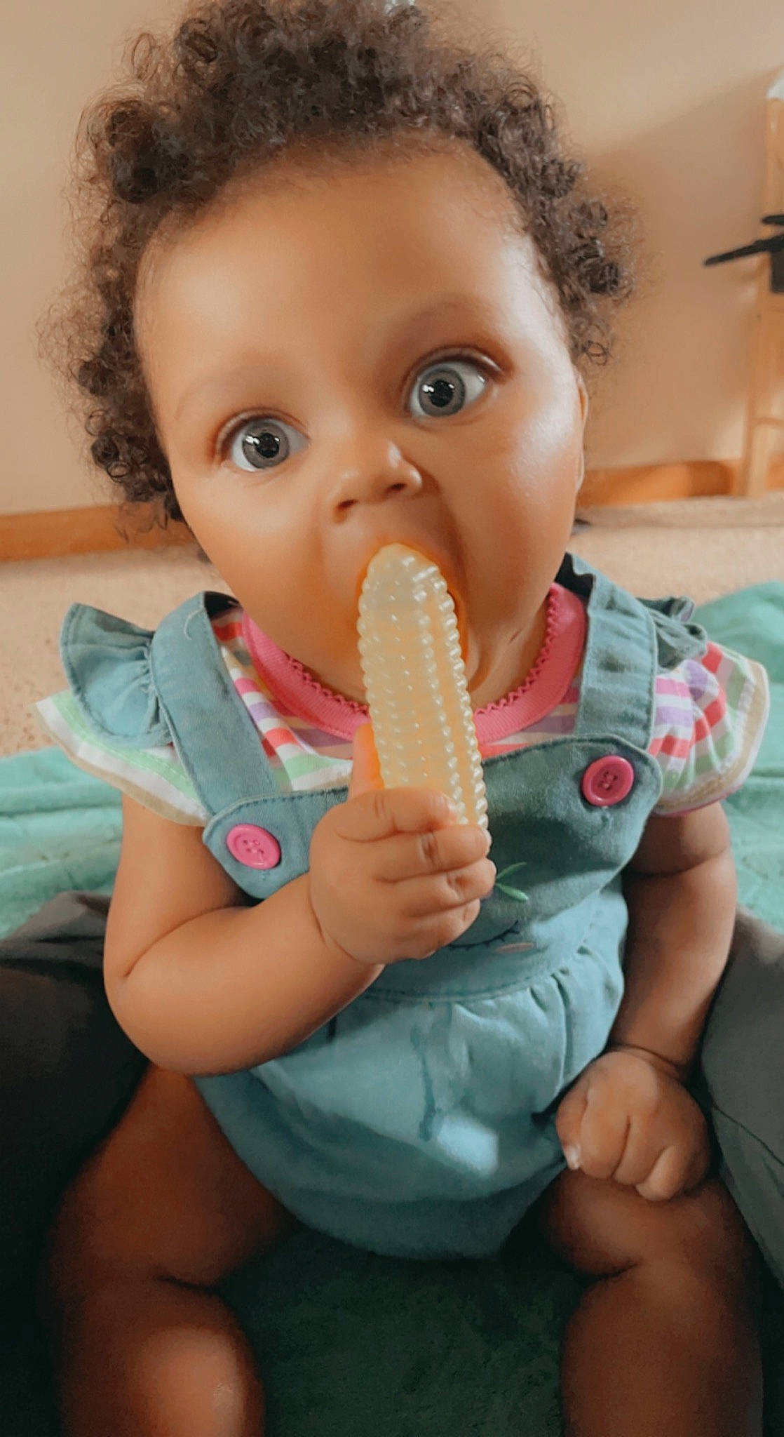 Kai is registered to the contest to win money with this photo: baby_toddler_clothing, biting, child, drinkware, facial_expression, finger, food, food_craving, gesture, hand, ice_cream_cone, ingredient, jaw, nail, person, skin, sweet_corn, sweetness, tableware, thumb