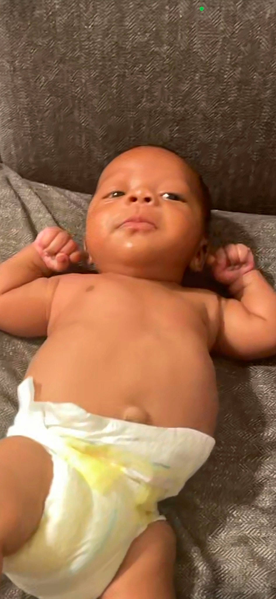 Osiah is registered to the contest to win money with this photo: arm, baby, cheek, eye, eyelash, gesture, hair, hand, head, human_body, iris, joint, lip, mouth, muscle, neck, nose, person, shoulder, skin