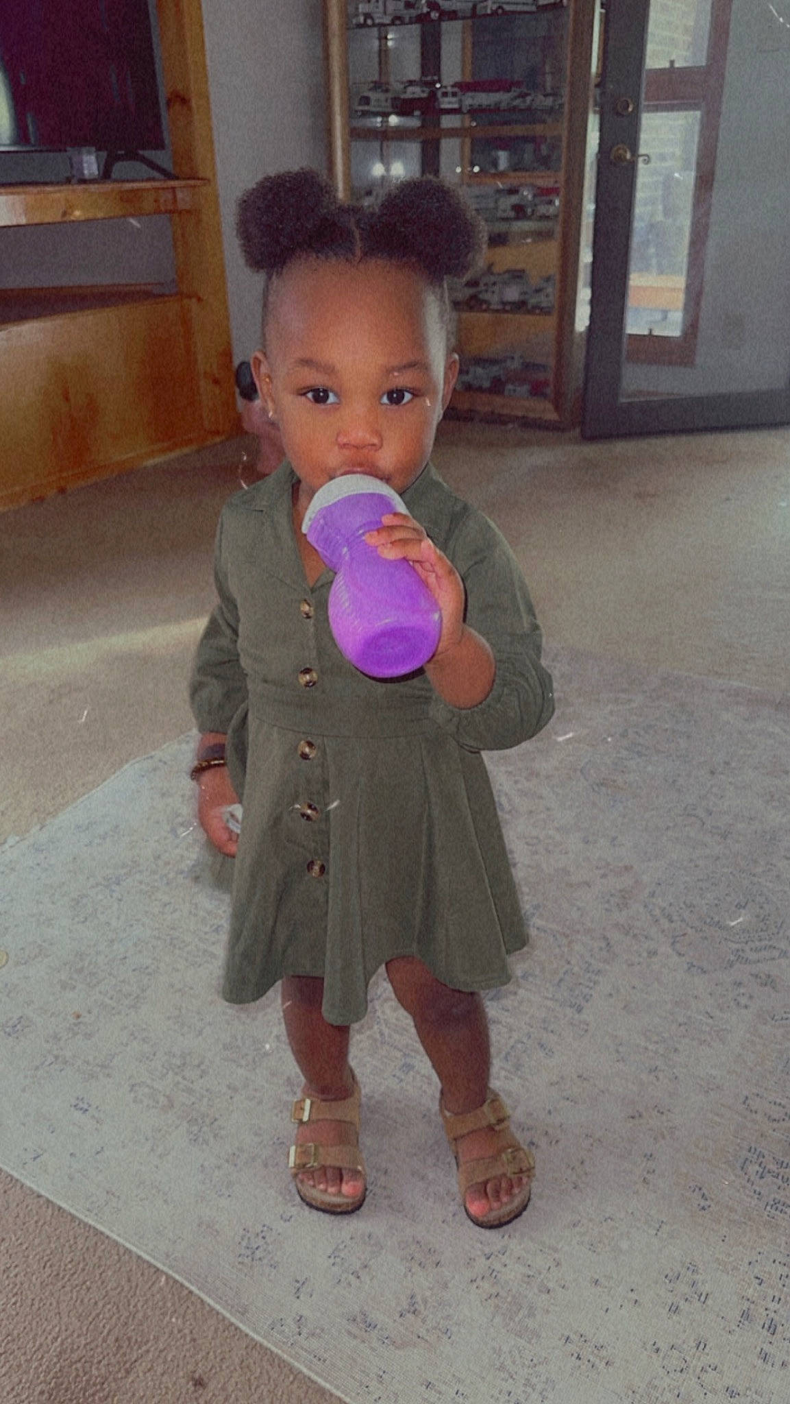 Hermione joined the competition — help win amazing prizes! baby_toddler_clothing, cheek, child, event, flooring, fun, head, jacket, leisure, magenta, person, play, sandal, shelf, sitting, skin, smile, toddler, vacation