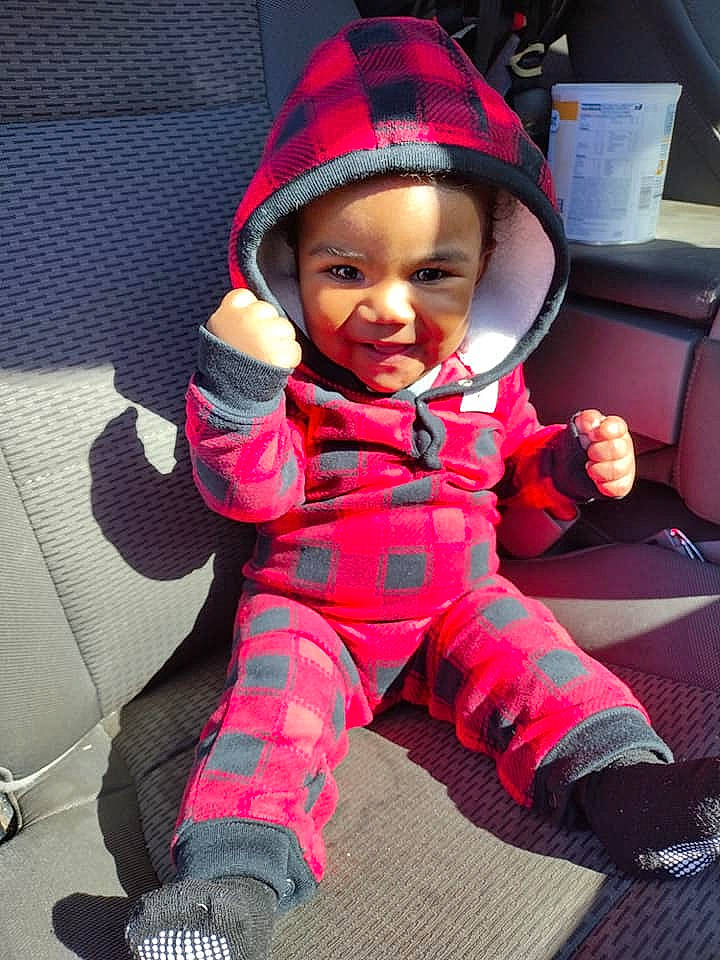 Avíon joined the competition — help win amazing prizes! arm, baby, baby_carriage, baby_toddler_clothing, cap, car_seat, child, comfort, cool, happy, lap, magenta, mouth, outerwear, person, personal_protective_equipment, red, sitting, sleeve, smile