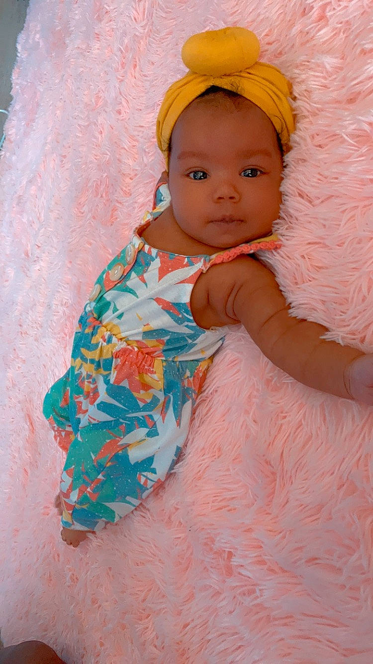 Jalea joined the competition — help win amazing prizes! baby, baby_products, baby_toddler_clothing, cap, child, dress, eye, face, fashion_accessory, fun, happy, linens, magenta, pattern, peach, person, pink, play, sitting, sleeve