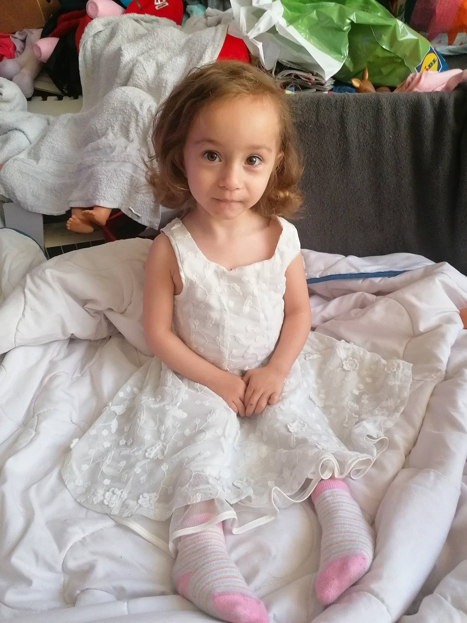 Haley participe au concours pour gagner de l'argent avec cette photo : baby_toddler_clothing, bridal_clothing, bridal_party_dress, day_dress, dress, embellishment, facial_expression, fashion_design, gown, hairstyle, happy, iris, person, pink, shoulder, skin, sleeve, smile, textile, wedding_ceremony_supply