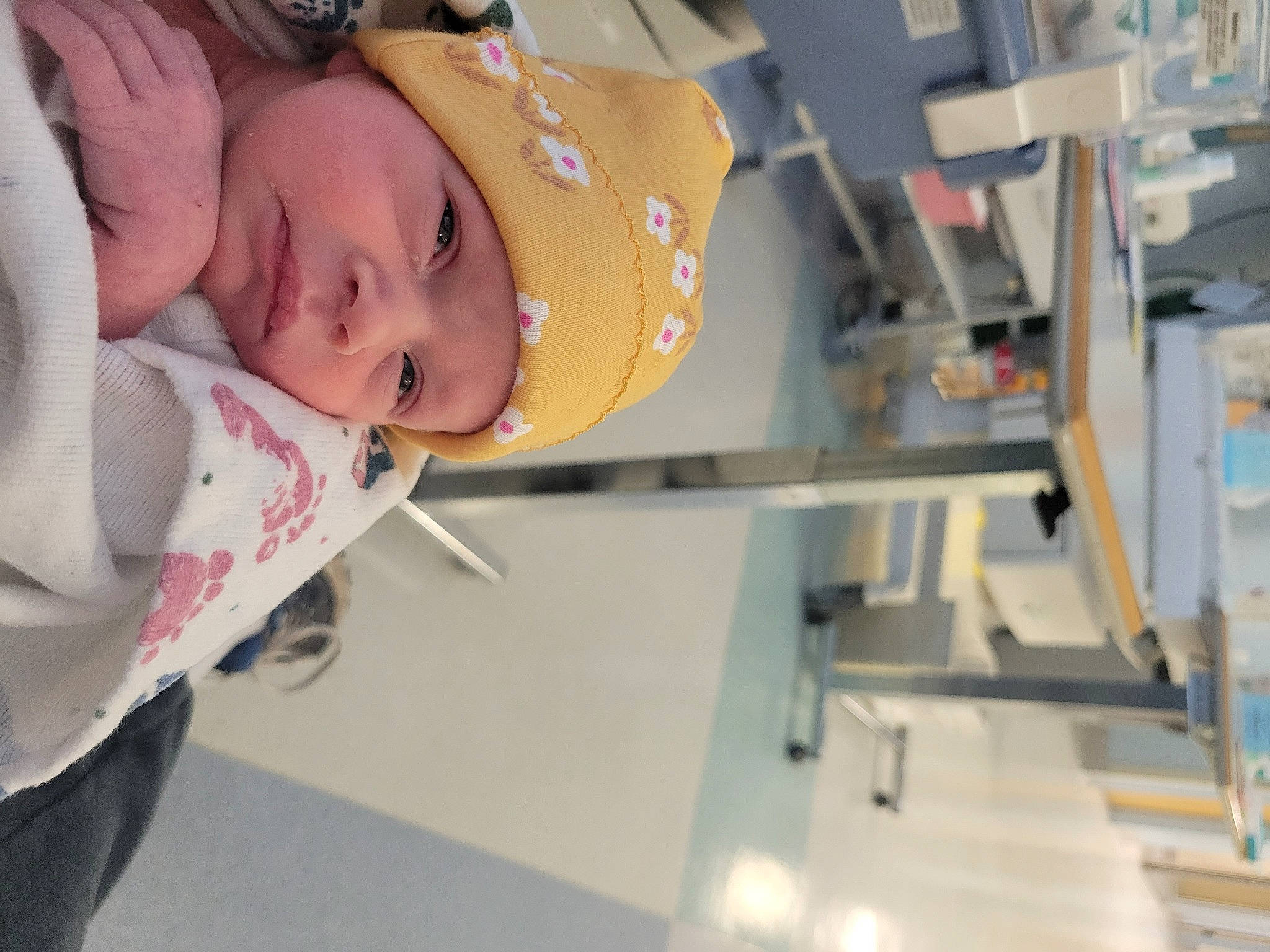 Evangeline is registered to the contest to win money with this photo: baby, baby_products, child, engineering, eyelash, fashion_design, fun, hat, headgear, headwear, machine, person, room, toddler