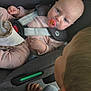 baby, toddler, car_seat, pacifier, maxi_cosi, child, infant, seatbelt, car_interior, pink_clothing, blond_hair, sibling, bonding, safety, looking, hand, face, closeup, transportation, curious