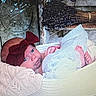 baby, bow, blanket, basket, blue, brown, cozy, face, headwear, infant, knitted, lying_down, person, portrait, resting, soft_texture, wood, wrapping, young_child, indoors