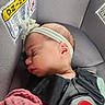 Ari is registered to the contest to win money with this photo: baby, sleeping, car_seat, headband, blanket, infant, child, seatbelt, closeup, face, profile, rest, safety, soft, cute, peaceful, indoors, newborn, person, toddler