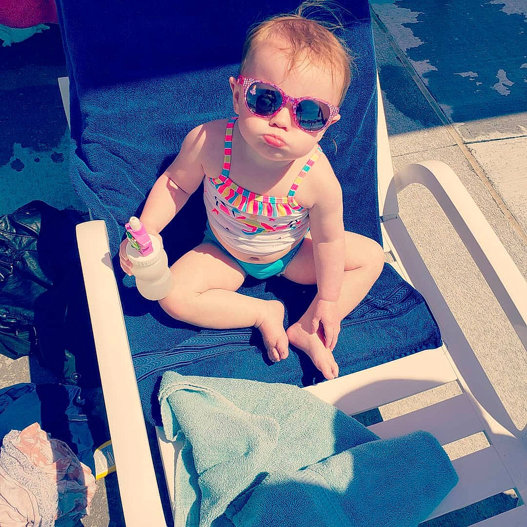 Alicyn is registered to the contest to win money with this photo: baby, blond, child, cool, eyewear, fun, glasses, leg, leisure, person, play, recreation, sitting, summer, sun_tanning, sunglasses, swimming_pool, swimwear, toddler, vacation
