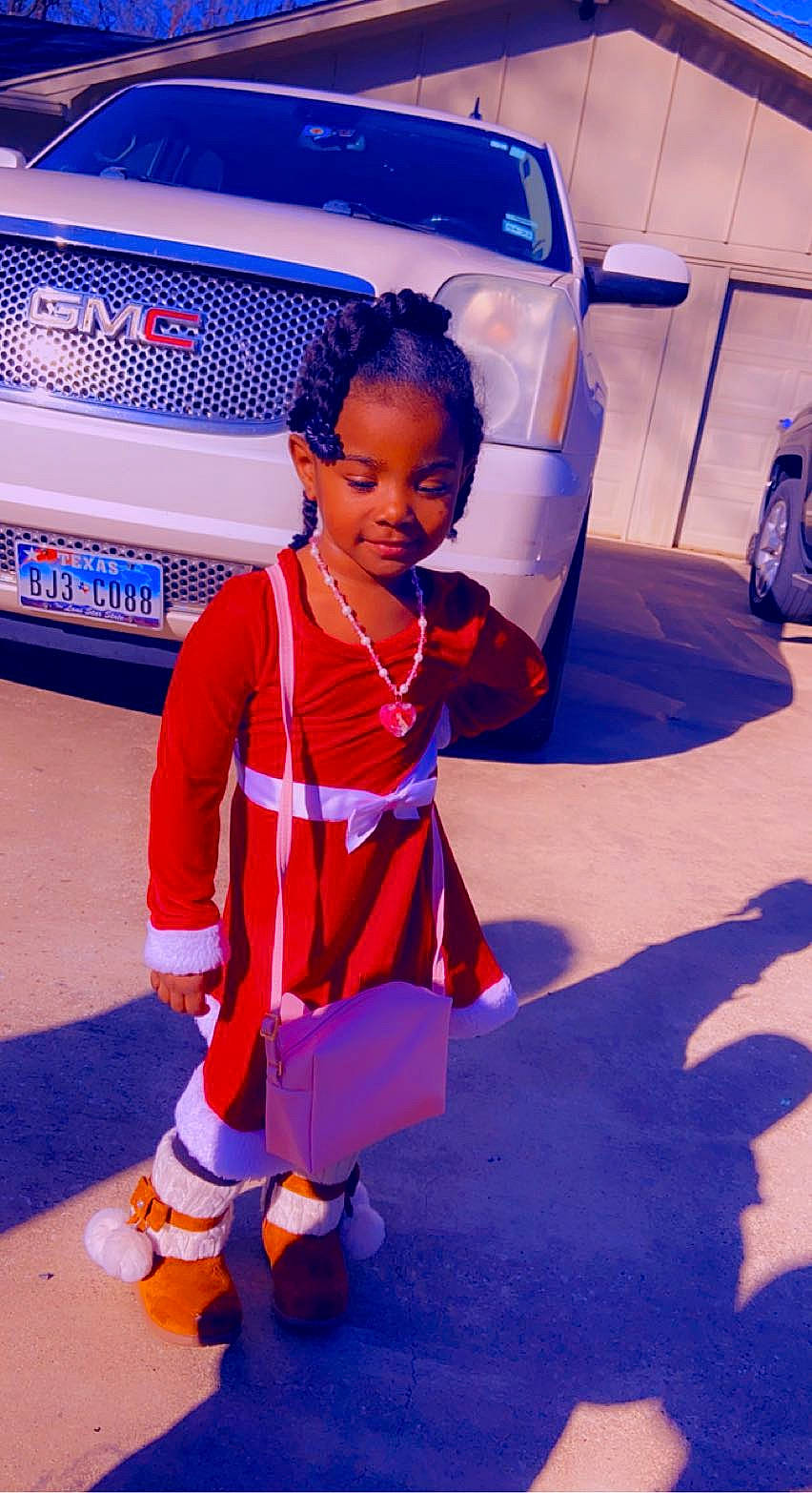 Amani joined the competition — help win amazing prizes! automotive_design, automotive_exterior, automotive_lighting, automotive_tire, blue, bumper, car, child, electric_blue, flooring, fun, hood, motor_vehicle, person, sneakers, standing, tire, toddler, trunk, vehicle