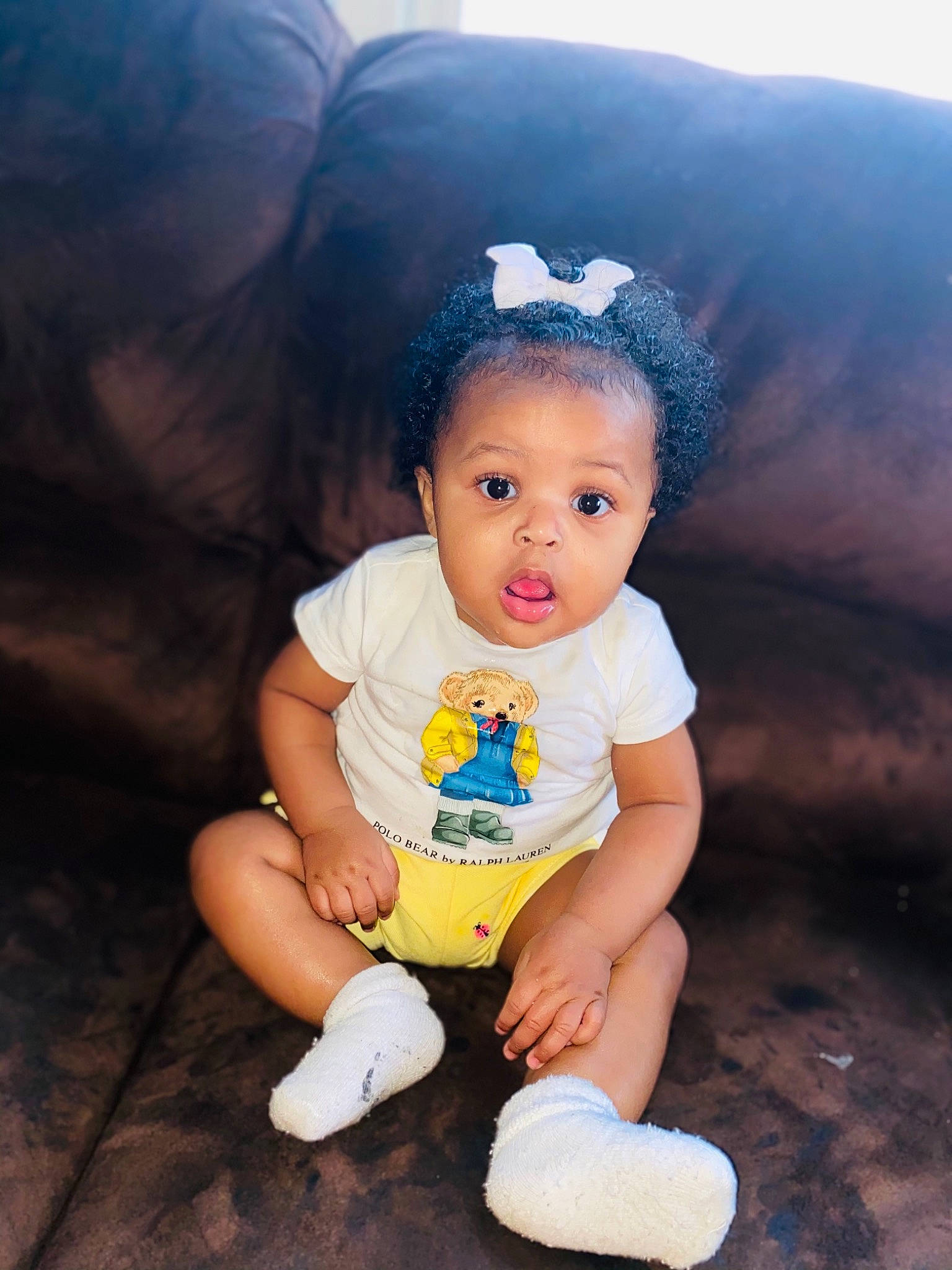 Sherleia is registered to the contest to win money with this photo: baby, baby_toddler_clothing, child, flash_photography, fun, grass, happy, headband, iris, person, play, portrait_photography, sandal, sitting, skin, sock, surprise, t_shirt, toddler, vacation