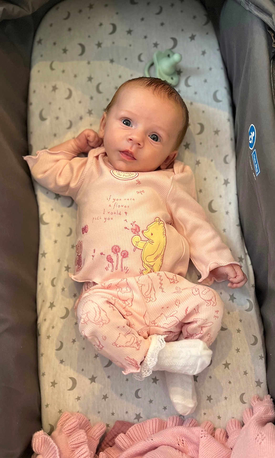 Lily joined the competition — help win amazing prizes! baby, infant, crib, pajamas, winnie_the_pooh, pink_clothing, white_socks, blanket, stars, moons, cute, sleeping_area, child, face, portrait, lying_down, soft_toys, cozy, newborn, resting