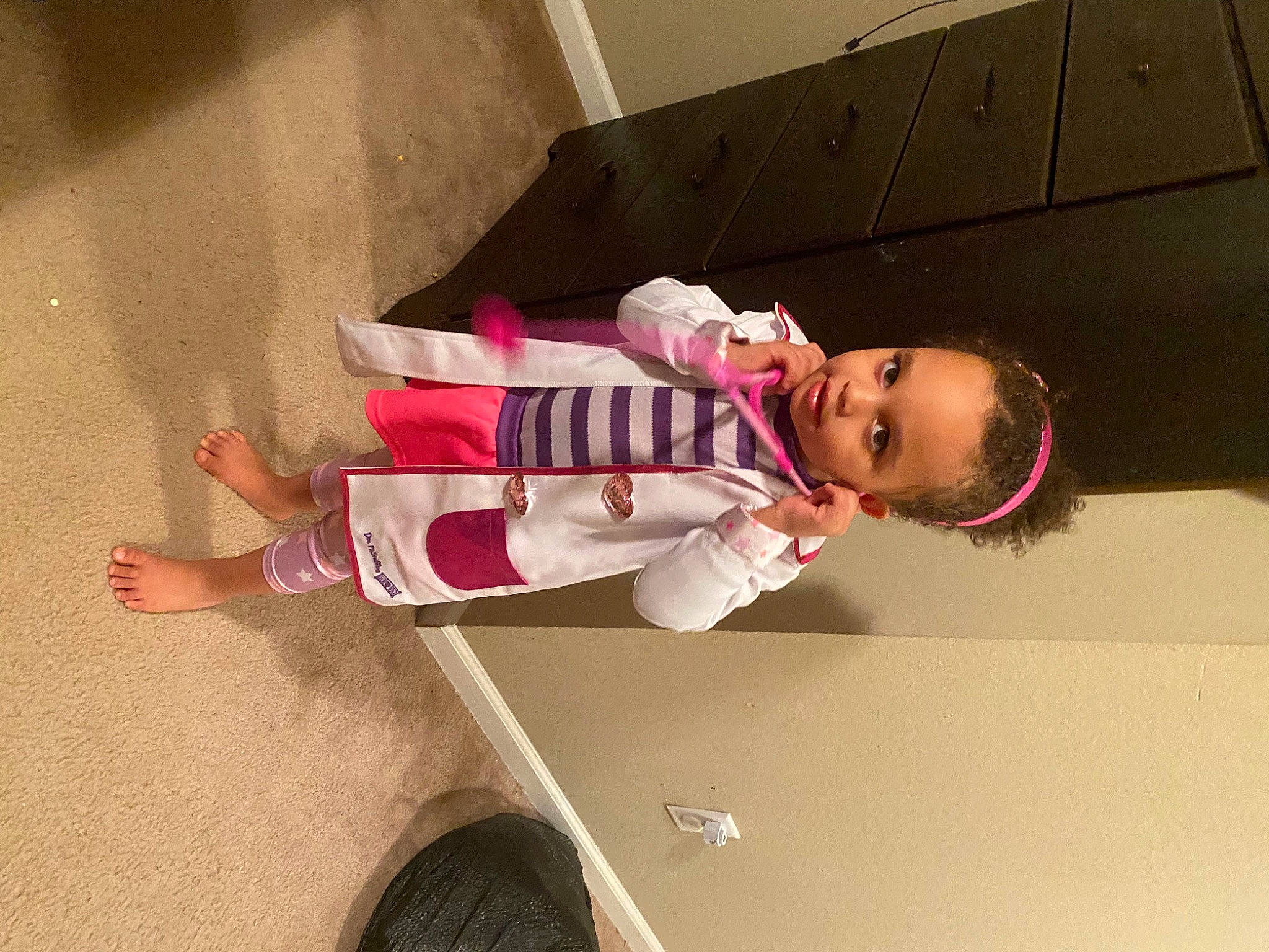 Katrina is registered to the contest to win money with this photo: baby, baby_toddler_clothing, carmine, child, elbow, flooring, fun, hardwood, hat, human_leg, knee, magenta, person, pink, play, room, sleeve, sock, thigh, toddler