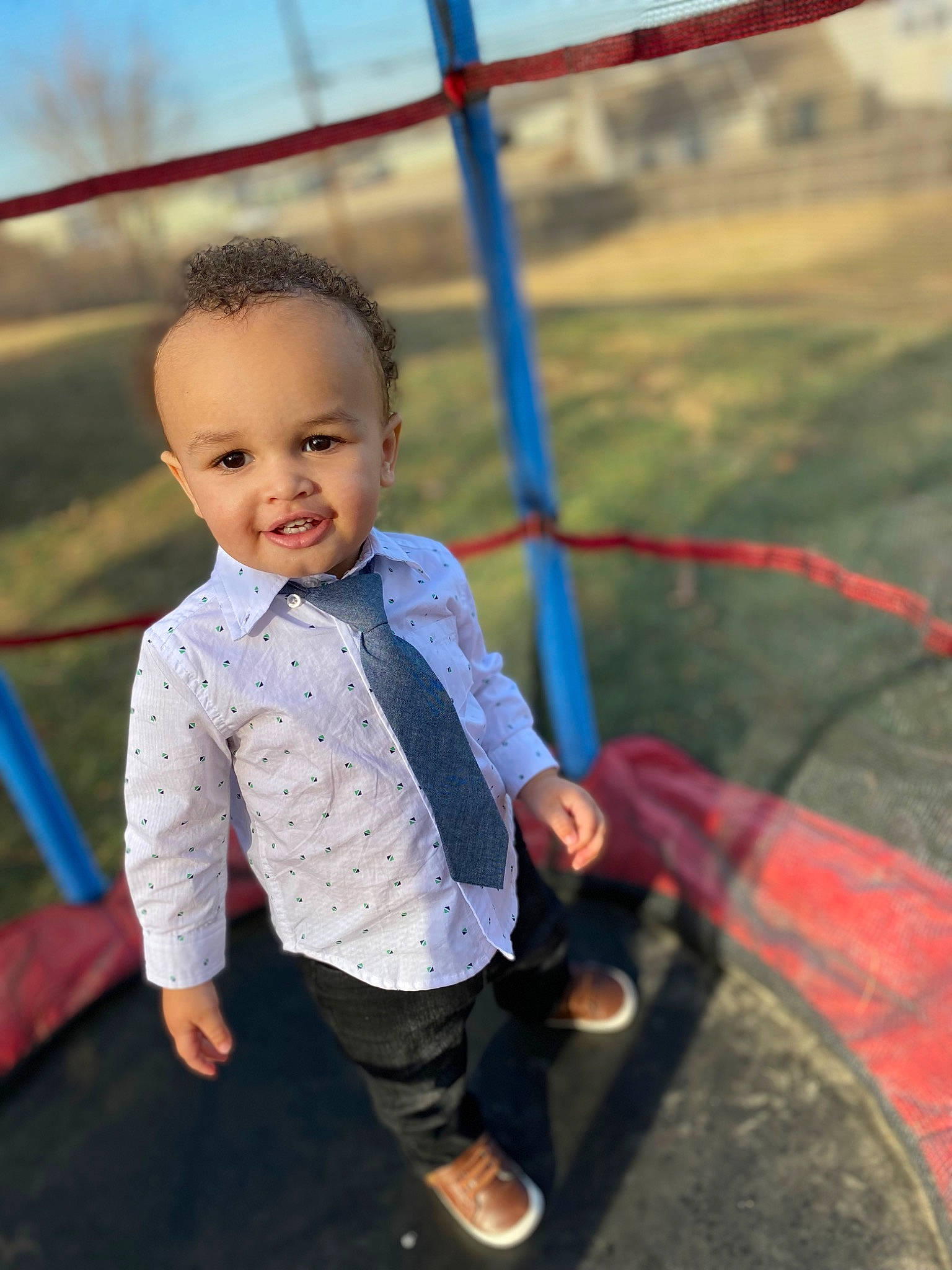 Liam joined the competition — help win amazing prizes! baby_toddler_clothing, child, city, denim, flash_photography, fun, grass, happy, joy, landscape, leisure, outdoor_play_equipment, person, recreation, sandal, sitting, skin, sky, smile, swing
