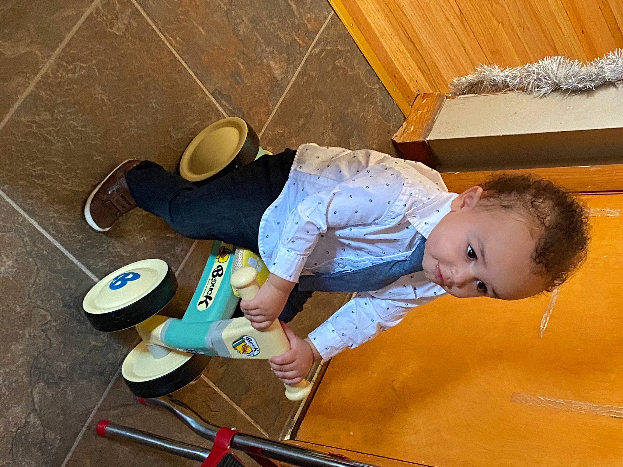 Liam joined the competition — help win amazing prizes! baby, baby_toddler_clothing, child, floor, flooring, foot, fun, hardwood, human_leg, leisure, person, play, room, sitting, smile, sneakers, t_shirt, thigh, toddler, varnish