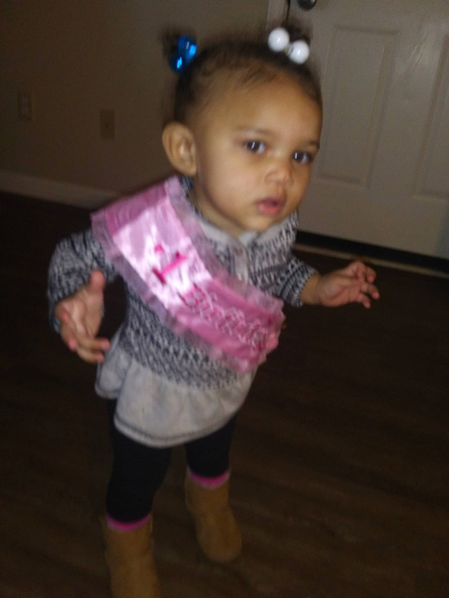 Sophia is registered to the contest to win money with this photo: baby, cheek, child, eye, face, floor, fun, head, iris, joint, person, pink, play, skin, standing, toddler