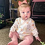 baby, child, bow, blue_eyes, carpet, clothing, couch, face, floor, furniture, indoor, infant, nursery, outfit, playpen, sitting, toy, winnie_the_pooh, young_child, pink_bow