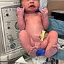 newborn, baby, hospital, medical_equipment, umbilical_cord, person, infant, gloves, bed, blanket, skin, feet, hands, face, nurse, clinic, healthcare, patient, delivery, birth