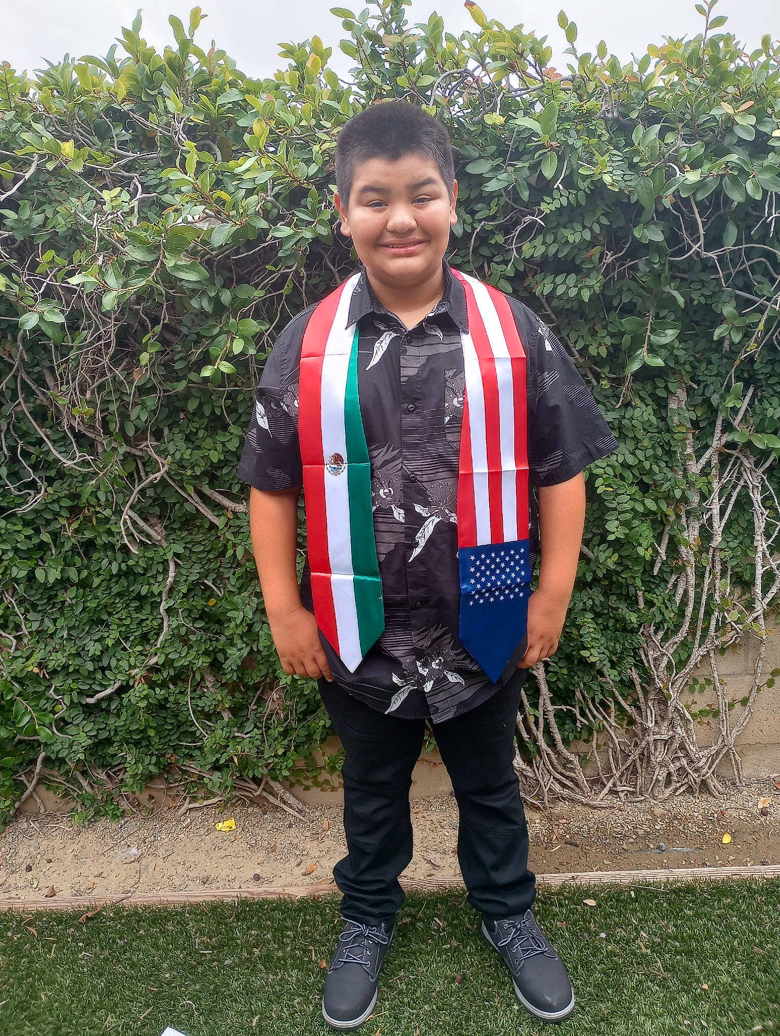 Carlos joined the competition — help win amazing prizes! child, electric_blue, face, formal_wear, grass, happy, joy, person, plant, shrub, sleeve, smile, soil, t_shirt, travel, uniform