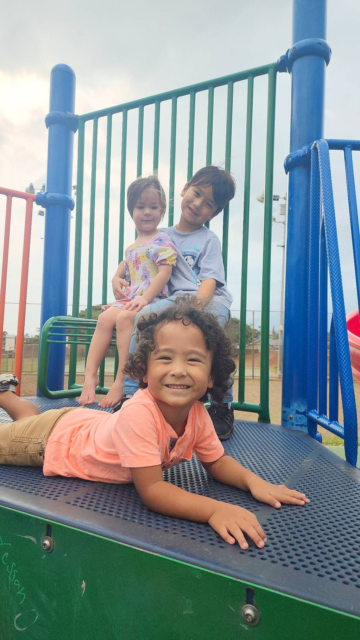 Blue is registered to the contest to win money with this photo: baby_toddler_clothing, blue, child, event, fun, grass, happy, joy, leisure, people, person, product, recreation, shorts, skin, sky, smile, standing, summer, t_shirt