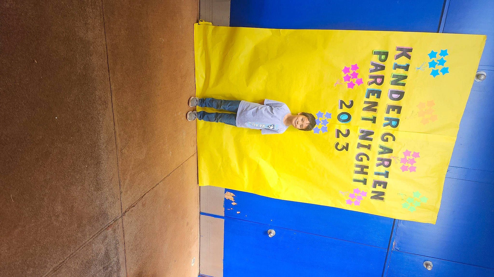 Braxton is registered to the contest to win money with this photo: advertising, banner, billboard, composite_material, concrete, electric_blue, font, gas, joy, logo, material_property, person, rectangle, signage, sleeve, transport, world