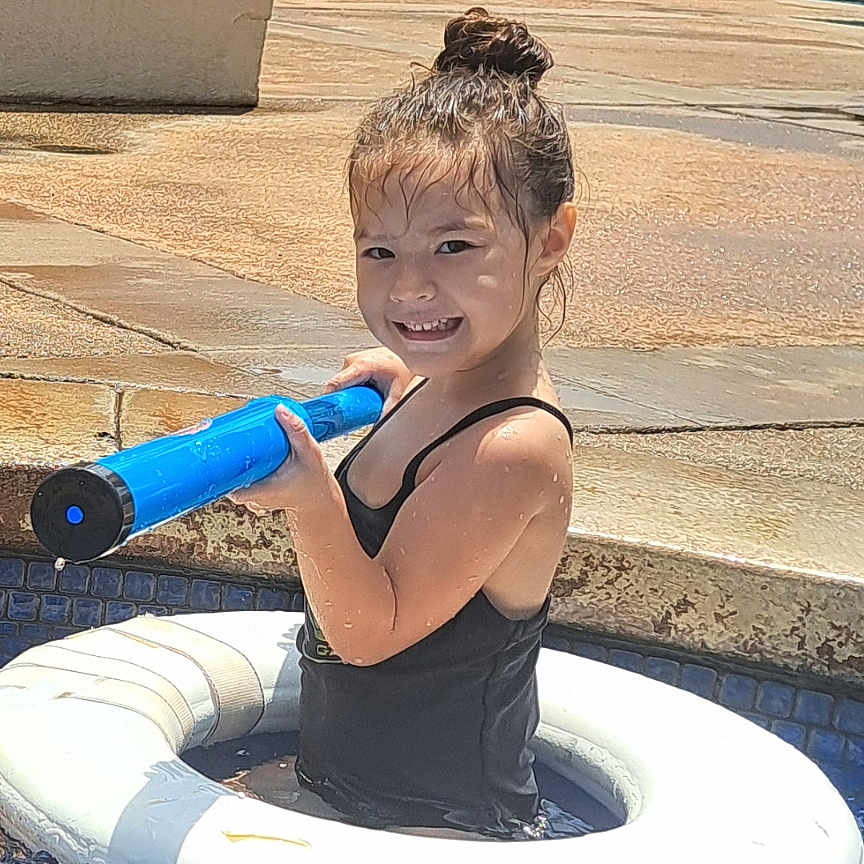 Kuuhiana is registered to the contest to win money with this photo: bottle, child, city, clothing, face, female, girl, head, nature, outdoors, person, photography, plant, pool, portrait, shaker, summer, swimmingpool, swimwear, water