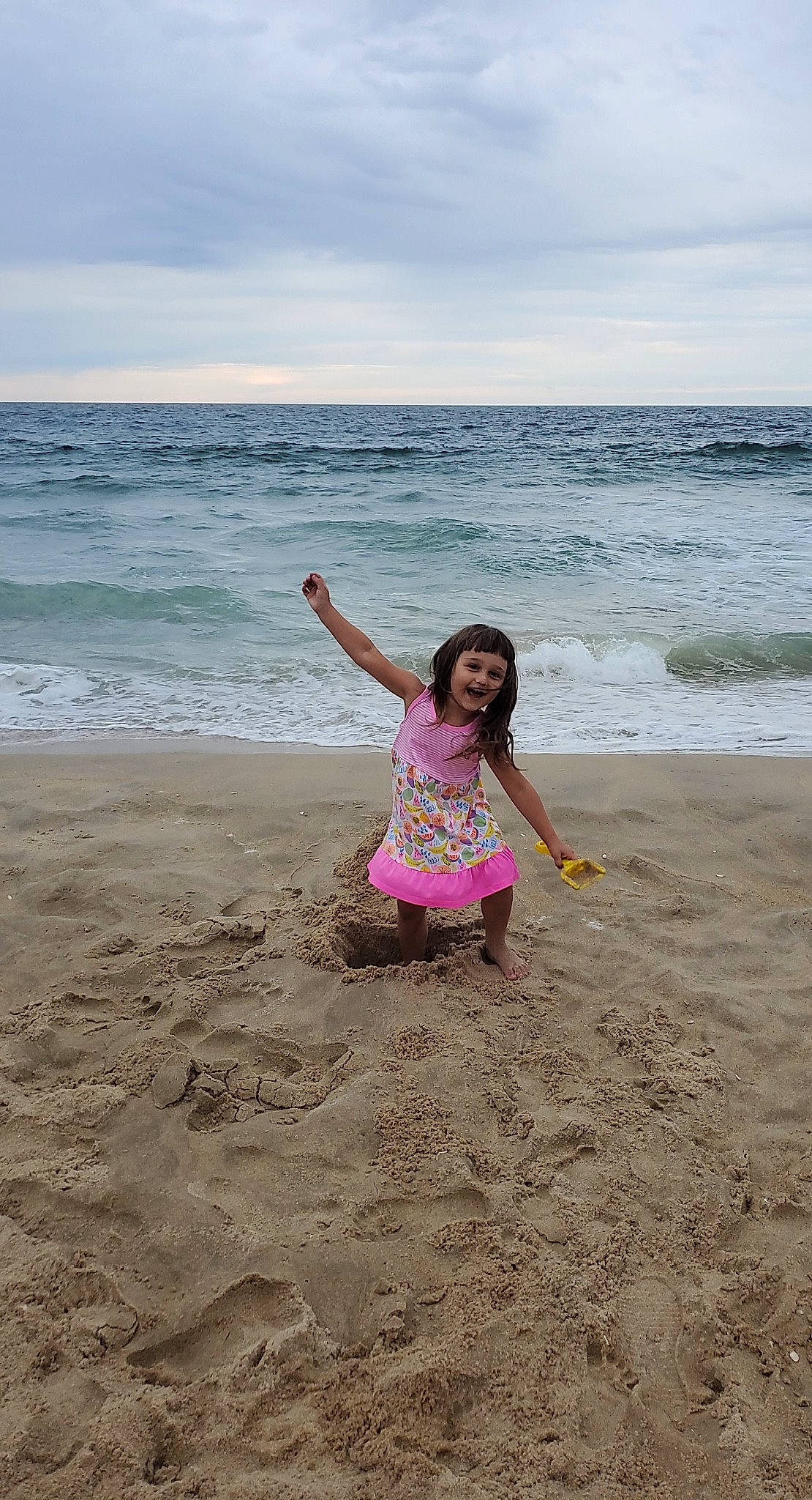 Mattie is registered to the contest to win money with this photo: beach, body_of_water, coast, coastal_and_oceanic_landforms, foot, fun, holiday, joy, leisure, ocean, people_in_nature, people_on_beach, person, pink, sand, sea, shore, summer, tide, vacation