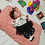 Zariyah is registered to the contest to win money with this photo: baby, barney, black_and_white_clothing, blanket, child, children_books, cute_outfit, headband, indoors, infant, lying_down, peaceful, pink_blanket, playful, purple_toy, sleeping, soft_texture, toddler, toys, white_bed