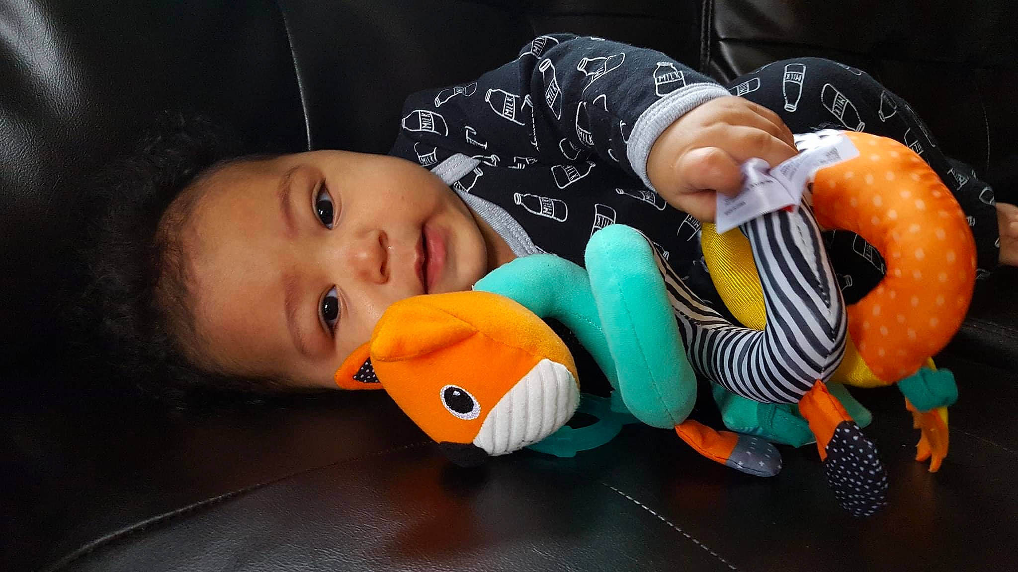 Victor Jr is registered to the contest to win money with this photo: baby, baby_toys, cheek, child, mouth, nose, orange, person, play, plush, product, stuffed_toy, textile, toddler, toy, yellow
