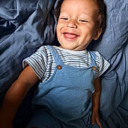 Leo joined the competition — help win amazing prizes! toddler, child, smiling, happy, blue_clothing, striped_shirt, blanket, bed, portrait, cute, baby, one_person, indoor, face, skin, short_hair, dimple, expressive, relaxed, comfort