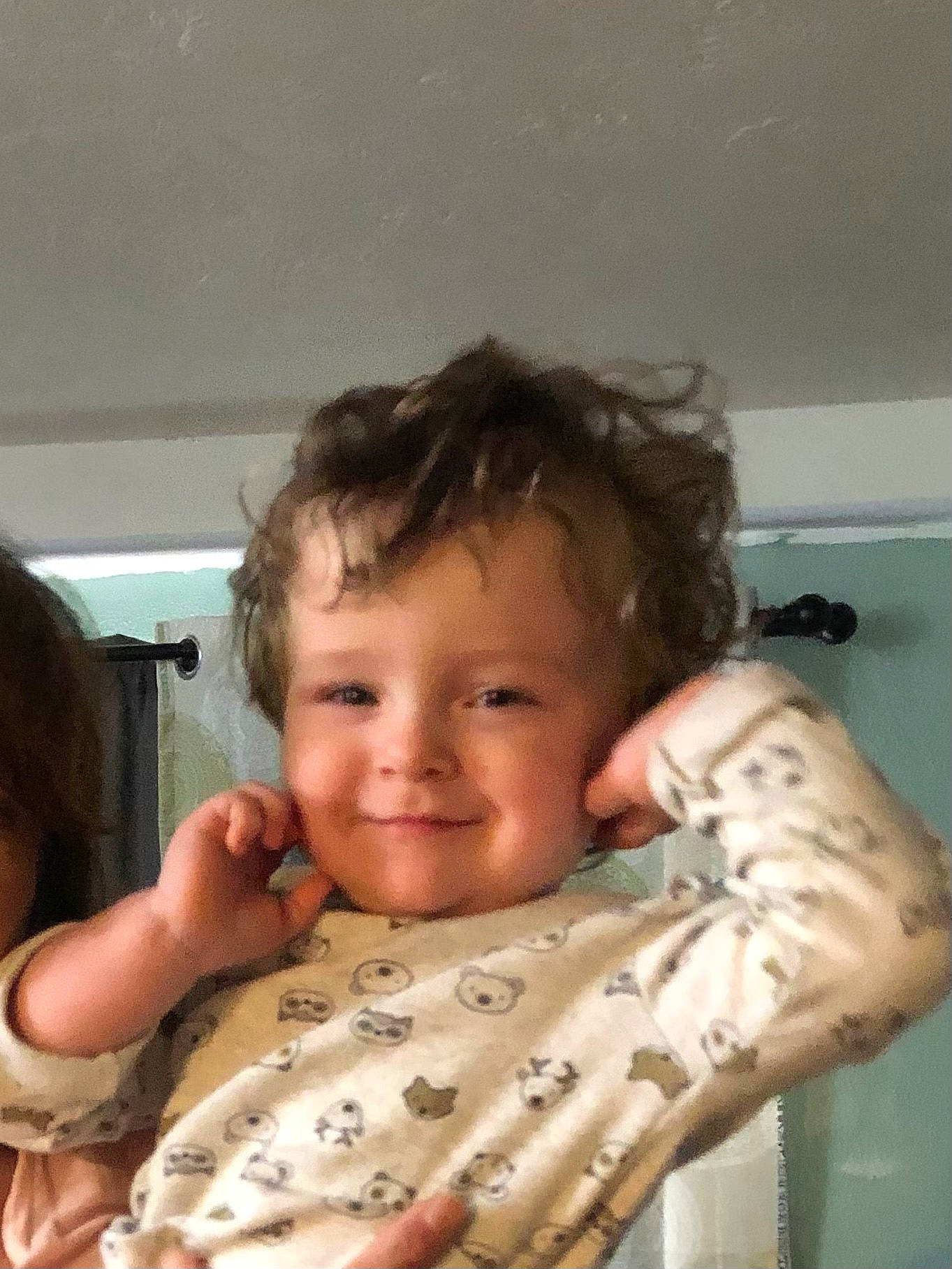 Mister is registered to the contest to win money with this photo: baby, baby_toddler_clothing, cheek, comfort, eyebrow, face, finger, gesture, hand, happy, head, human_body, joy, lip, mouth, nose, person, skin, sleeve, smile