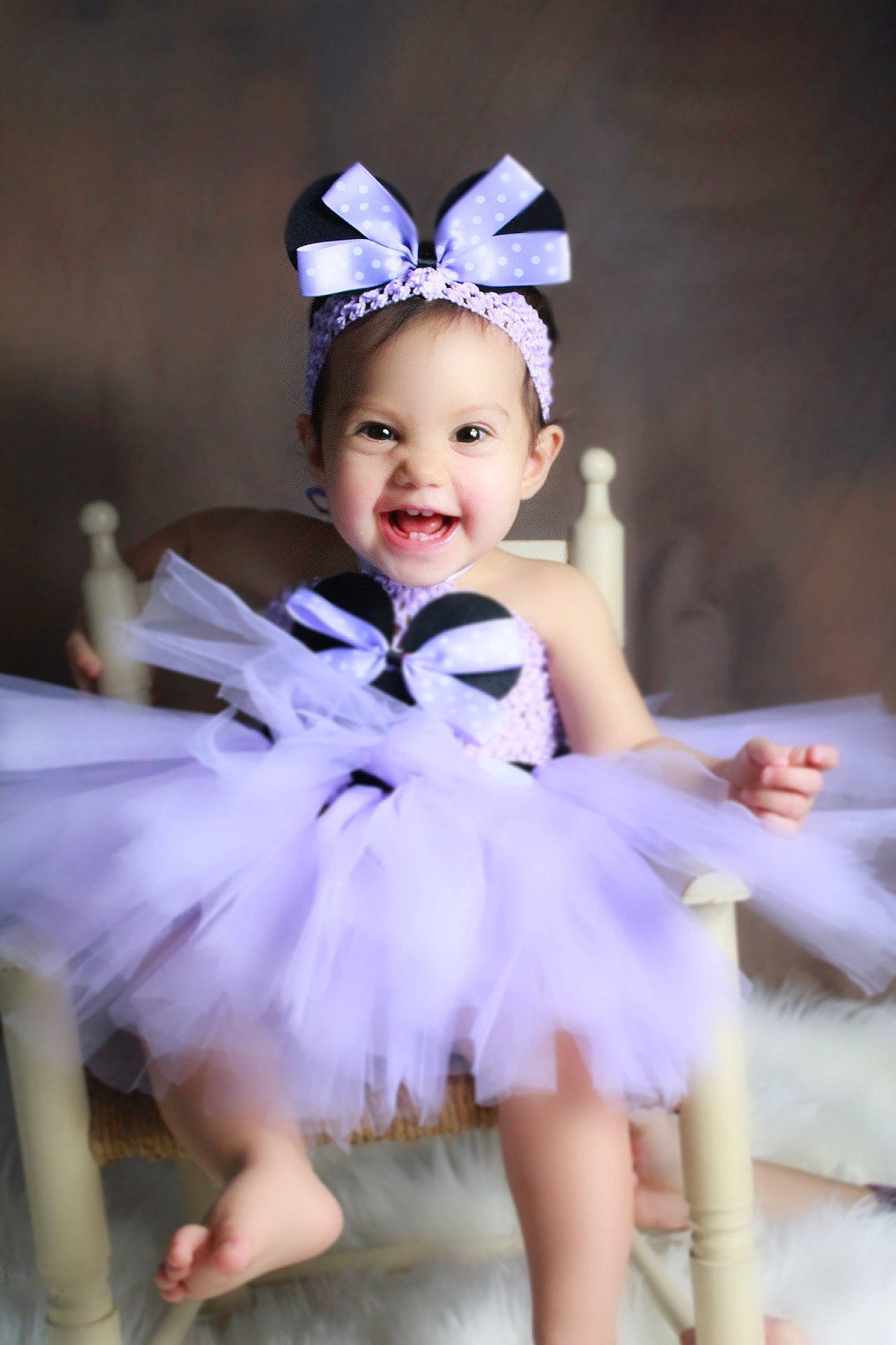Lilou participe au concours pour gagner de l'argent avec cette photo : baby_toddler_clothing, child, dress, event, face, facial_expression, flash_photography, fun, happy, headgear, headpiece, iris, joy, light, person, pink, purple, skin, smile, toddler