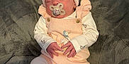 Matilda is registered to the contest to win money with this photo: baby, sleeping, pacifier, hat, pink, white, clothing, blanket, soft, cute, infant, child, pom_pom, knitwear, resting, portrait, newborn, cozy, small_hands, peaceful