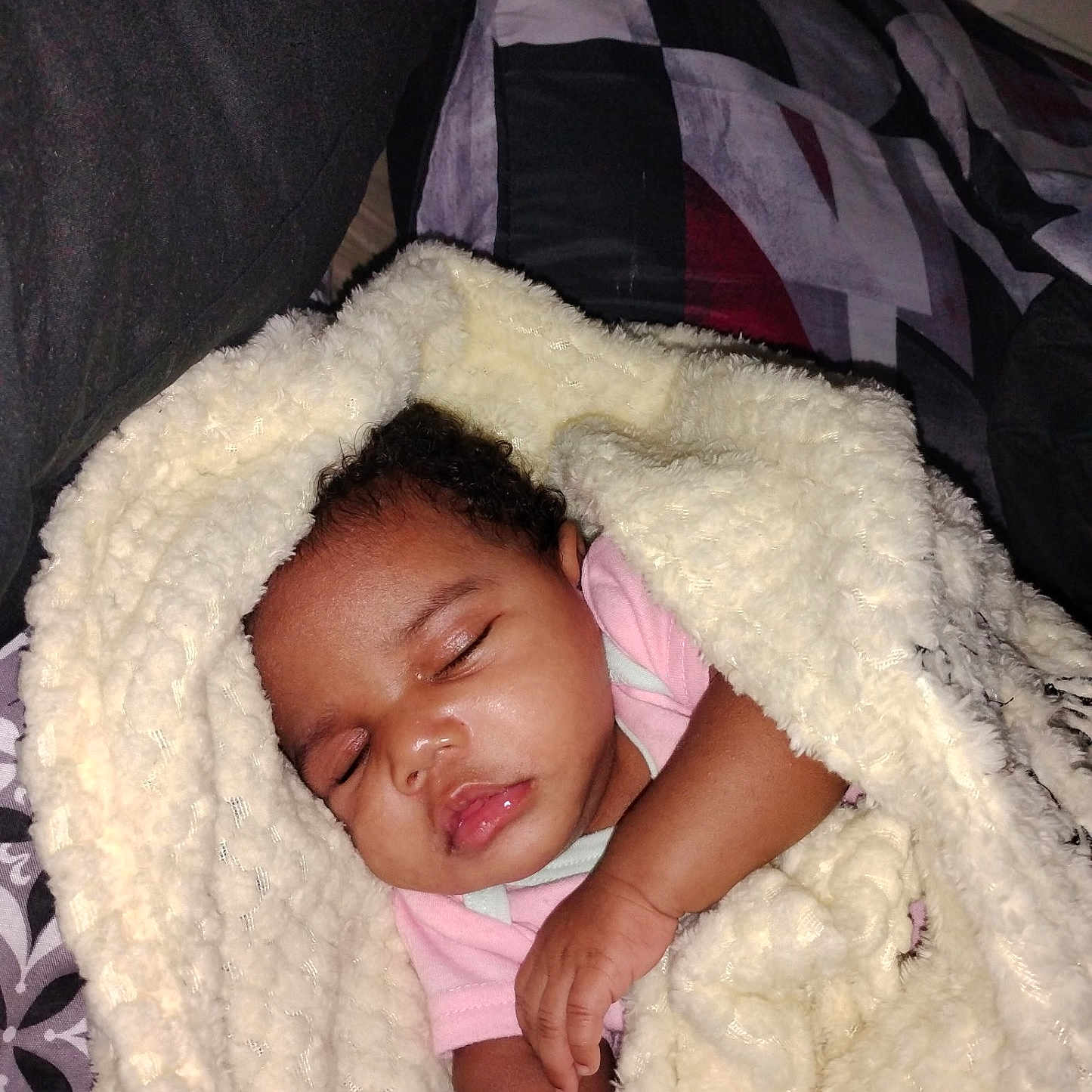 Dejah is registered to the contest to win money with this photo: baby, sleeping, blanket, pacifier, infant, cozy, bed, soft, child, curly_hair, peaceful, indoors, pink_clothing, wrapped, resting, cute, comfort, portrait, closeup, toddler